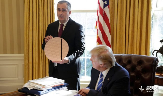 U.S. President Donald Trump watches as Chief Executive Officer of Intel Brian Krzanich (L) displays a silicon wafer for making chips in the Oval Office of the White House in Washington, U.S., February 8, 2017. REUTERS/Joshua Roberts