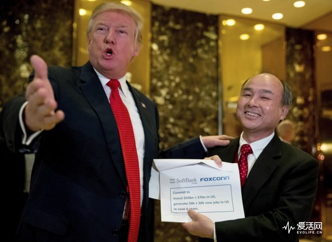 President-elect Donald Trump, accompanied by SoftBank CEO Masayoshi Son, speaks to members of the media at Trump Tower in New York, Tuesday, Dec. 6, 2016. (AP Photo/Andrew Harnik)